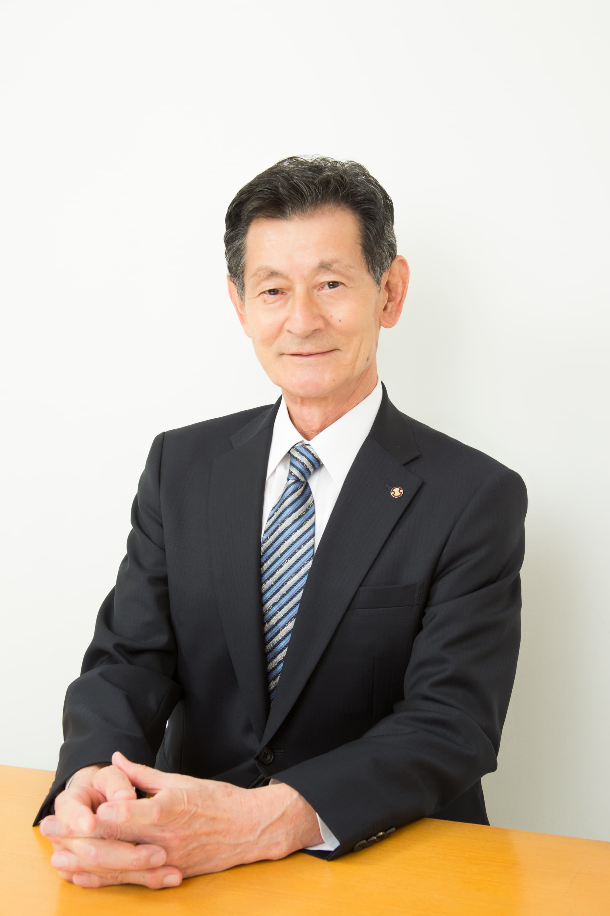 代表取締役社長 飯塚 榮一